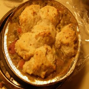sausage w/potato and gravy topped with biscuits_image