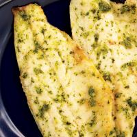 Grilled fish fillet with pesto sauce image