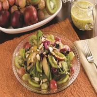 Spinach Salad with fresh Grapes, Plums, Peaches and Kiwis_image