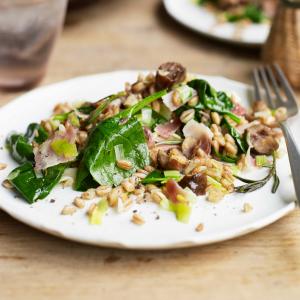 Warm grain salad with bacon, leeks & spinach image