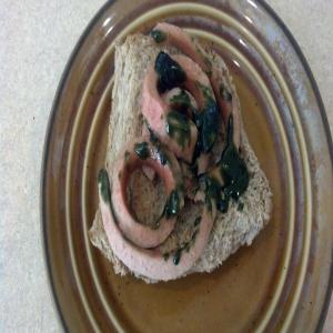 Worms on a Bun With Zombie Sauce image