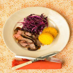 Chili-Rubbed Flank Steak With Cabbage Salad And Polenta Rounds image
