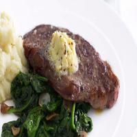 New York steak with garlic-wilted spinach_image