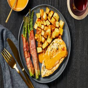 Buttery Garlic-Herb Chicken with Prosciutto-Wrapped Asparagus & Herbed Potatoes_image