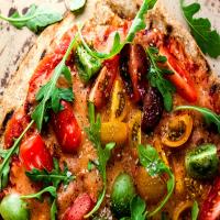 Pizza on the Grill With Cherry Tomatoes, Mozzarella and Arugula image
