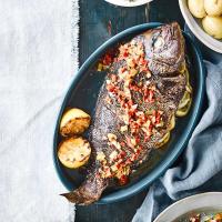 Barbecued bream with spring onions, lemon & chilli image