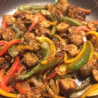 Spicy Sausage and Peppers Over Rice image