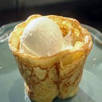 Crepes Suzette with Vanilla Ice Cream and Orange Butter Sauce_image