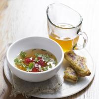 Tomato consommé with Lancashire cheese on toast image