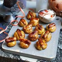 Halloween mini baked potatoes with sticky sausages image