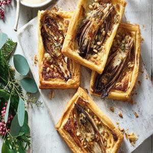 Balsamic chicory, pine nut & blue cheese tartlets image