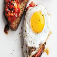 Charred Tomatoes with Fried Eggs on Garlic Toast image