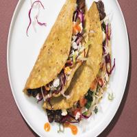 Crispy Black Bean Tacos with Feta and Cabbage Slaw image
