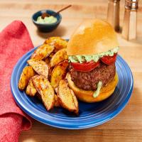 Mozz-Stuffed Caprese Burgers with Griddled Tomato, Creamy Pesto & Potato Wedges_image