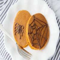 Pumpkin Pancakes with Halloween Spiderwebs image