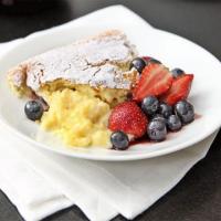 Luscious lemon pudding with summer berries image
