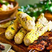 Grilled corn with garlic mayo & grated cheese image
