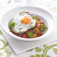 Potato, pepper & chorizo stew with fried eggs image