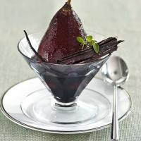 Poached pears in spiced red wine image