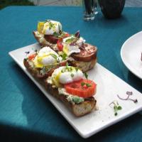 Poached Eggs on Toasted Baguette with Goat Cheese, and Black Pepper Vinaigrette image