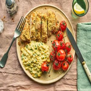 Healthy baked chicken schnitzel with creamed corn image