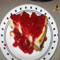 Luscious Lemon Cheesecake With Raspberry Sauce image