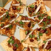Flatbread with White Bean Hummus, Caramelized Onions, Black Olives and Spanish White Anchovies_image