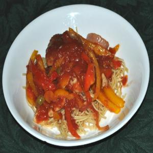 Braised Chicken Thighs With Bell Peppers, Olives and Tomatoes image