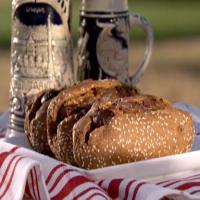 Wisconsin Beef and Cheddar Brats with Beer-Braised Onions image