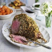 Herb-crusted leg of lamb with red wine gravy_image