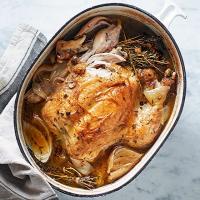 Pot-roast chicken with stock image