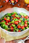 strawberry-blueberry-greens-salad-with-honey image