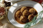 slow-cooker-meatballs-and-gravy-recipe-the-spruce image