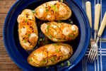 rich-and-cheesy-shrimp-stuffed-baked-potatoes image