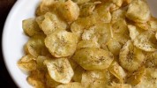 homemade-fried-banana-chips-raw-banana-wafers image