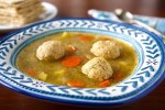 vegan-matzo-ball-soup-with-spring-vegetables image
