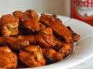 grilled-chicken-wings-with-seasoned-buffalo-sauce image