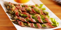 how-to-make-bacon-wrapped-asparagus-delish image