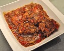 slow-cooker-pork-chops-with-peppers-and-tomatoes image