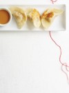 pork-dumplings-with-peanut-sauce-ricardo image