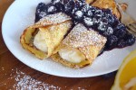 sweet-ricotta-filled-crpes-rustic-plate image
