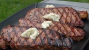 new-york-strip-steaks-with-blue-cheese-butter image