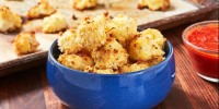 how-to-make-parmesan-cauliflower-bites-recipe-delish image