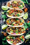 blackened-cajun-shrimp-tacos-with-avocado-salsa image
