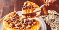 how-to-make-snickers-cheesecake-delish image