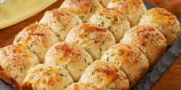 best-cheesy-garlic-butter-rolls-recipe-delish image