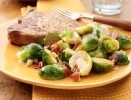caramelized-onion-bacon-brussels-sprouts-recipe-land-olakes image
