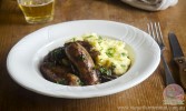 slow-cooker-sausages-in-onion-gravy-stay-at-home image