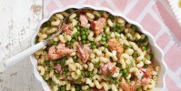 spring-pasta-with-salmon-peas-and-dill-country-living image