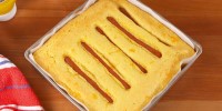 best-hot-dog-stuffed-cornbread-recipe-delish image